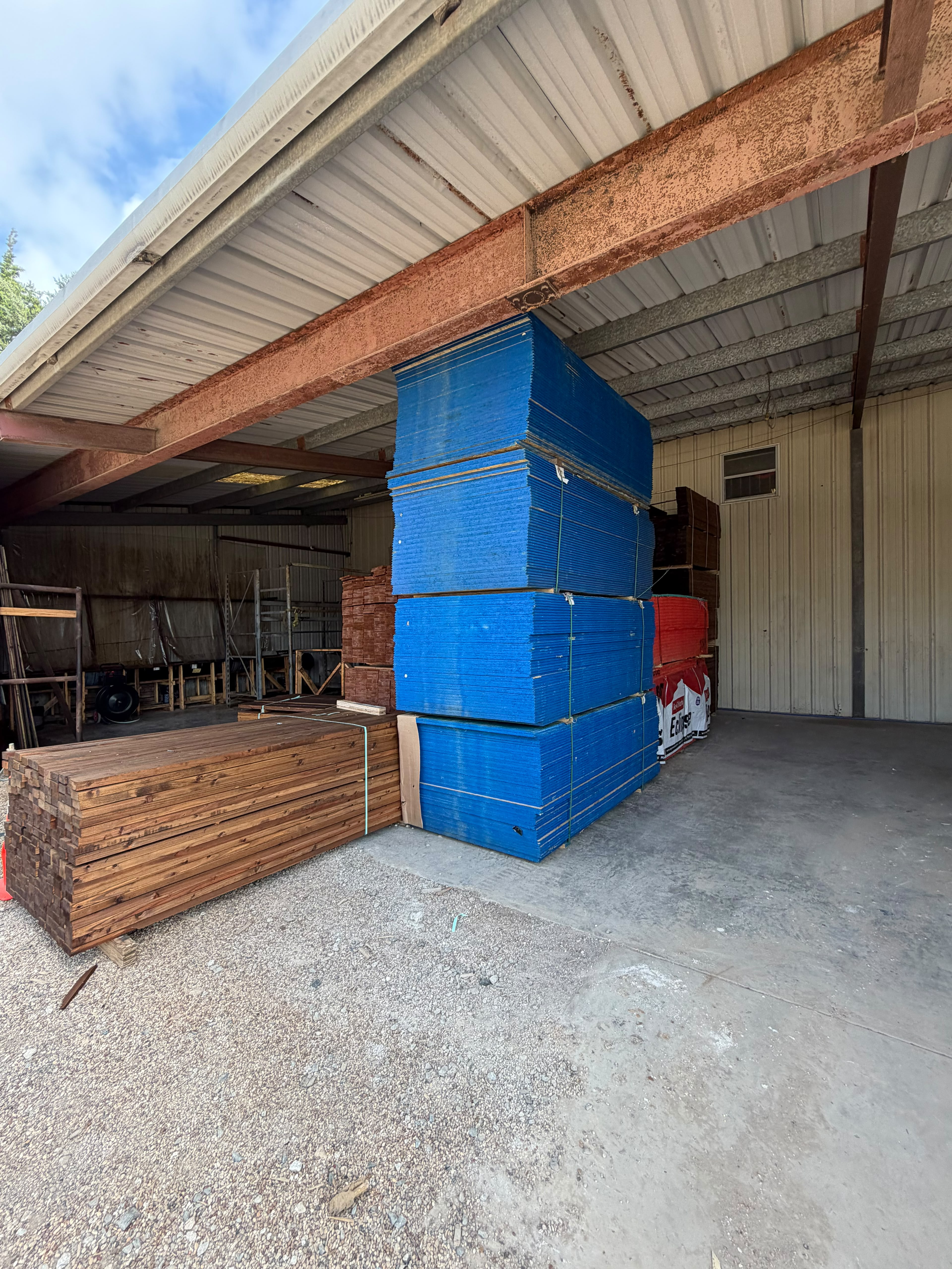 Pre-stained cedar fence boards and panels in warehouse